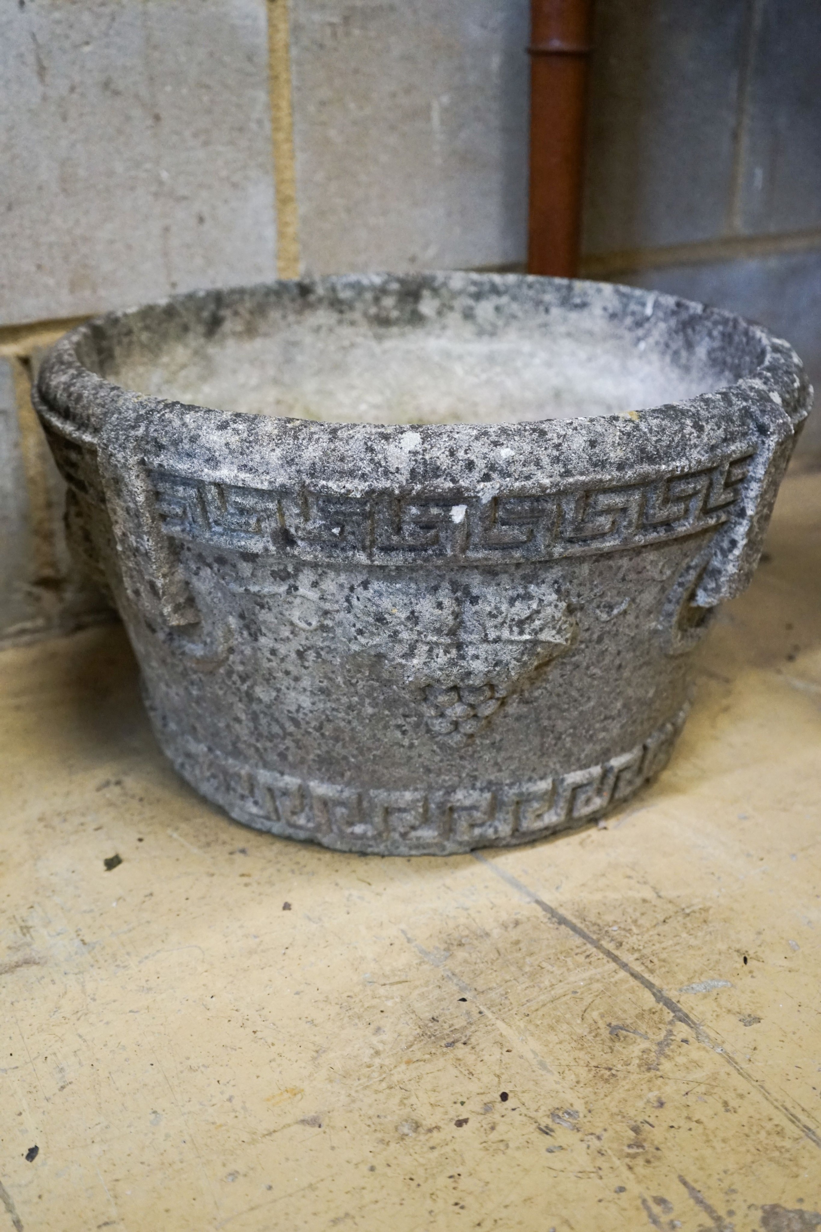 Four assorted reconstituted stone garden urns and a galvanised tub